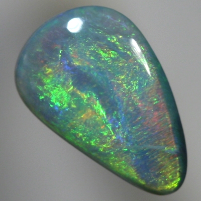 SOLID SEMI BLACK OPAL Glowing with bright greens over a beautiful blue